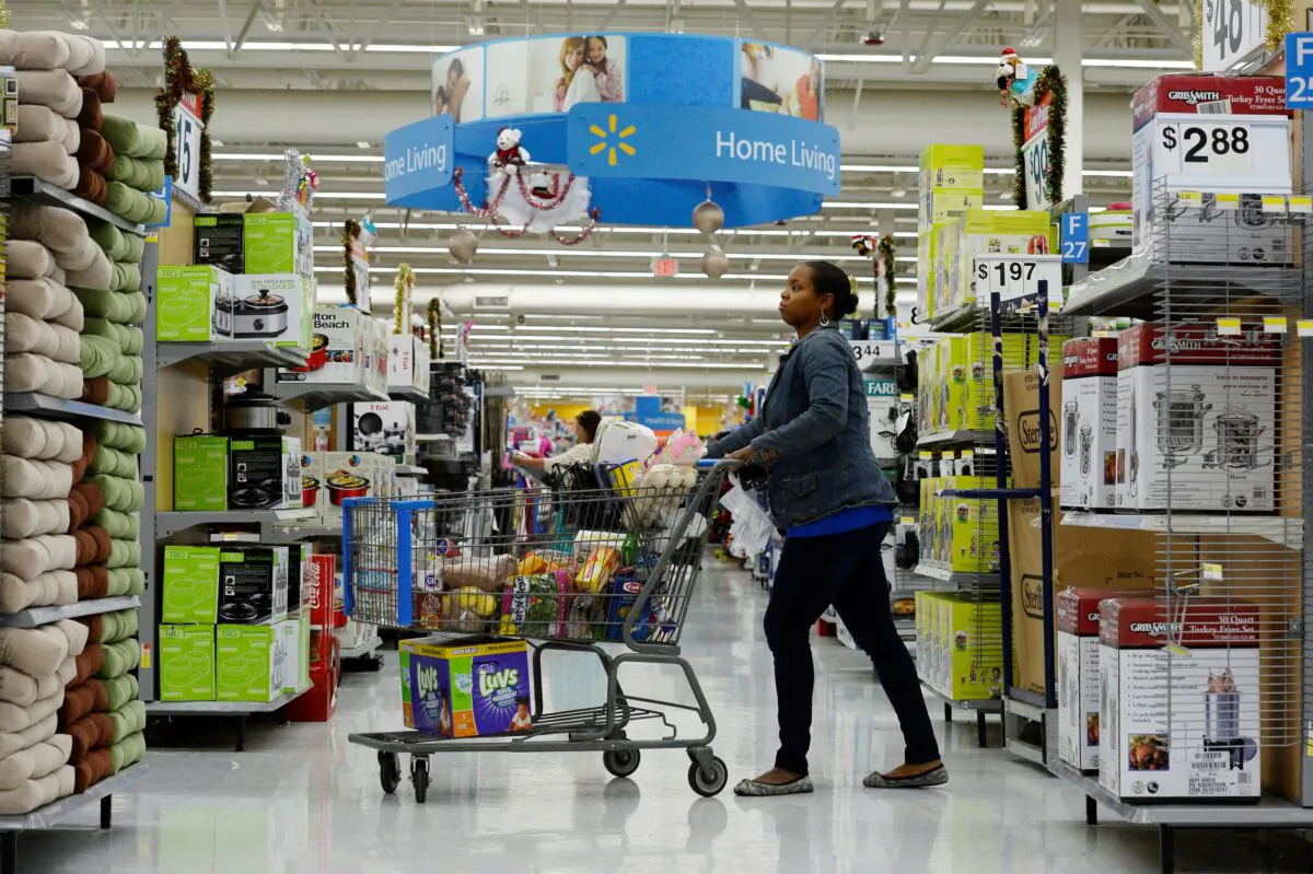 A customer pushes her shopping cart at a Walmart store in the Porter Ranch section of Los Angeles on Nov. 26, 2013. (Kevork Djansezian/Reuters)