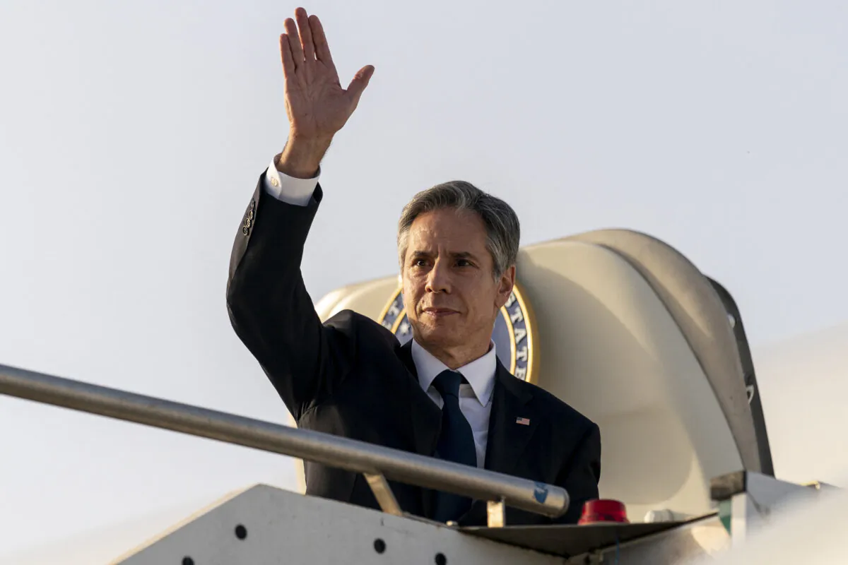 US Secretary of State Antony Blinken waves before boarding his plane at Ciampino Airport in Rome to travel to Bari, Italy on June 28, 2021, as part of Blinken's week long trip in Europe. (Andrew Harnik/Pool/AFP via Getty Images)