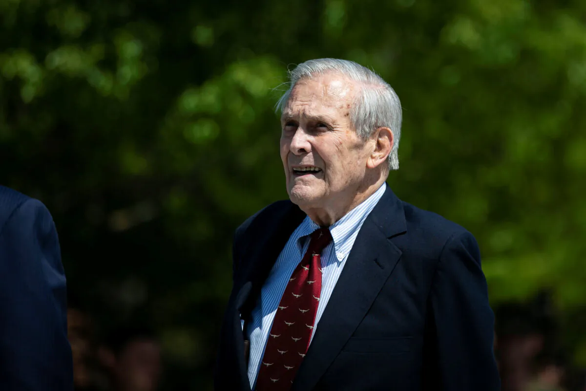Former U.S. Defense Secretary Donald Rumsfeld looks on after former U.S. President George W. Bush placed a wreath during the 18th anniversary of Sept. 11 attacks at the Pentagon in Arlington, Va., on Sept. 11, 2019. (REUTERS/Al Drago)