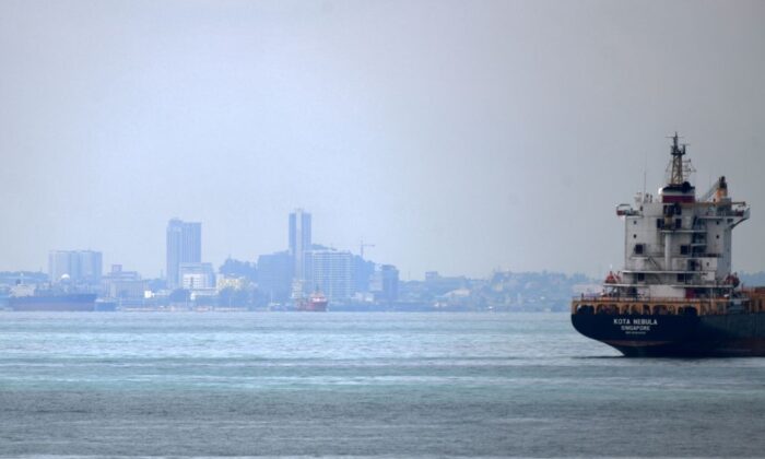 A vessel is seen opposite the Marina Pier in front of Indonesia's Batam Island (background) in Singapore on May 2, 2020. (Roslan Rahman/AFP via Getty Images)