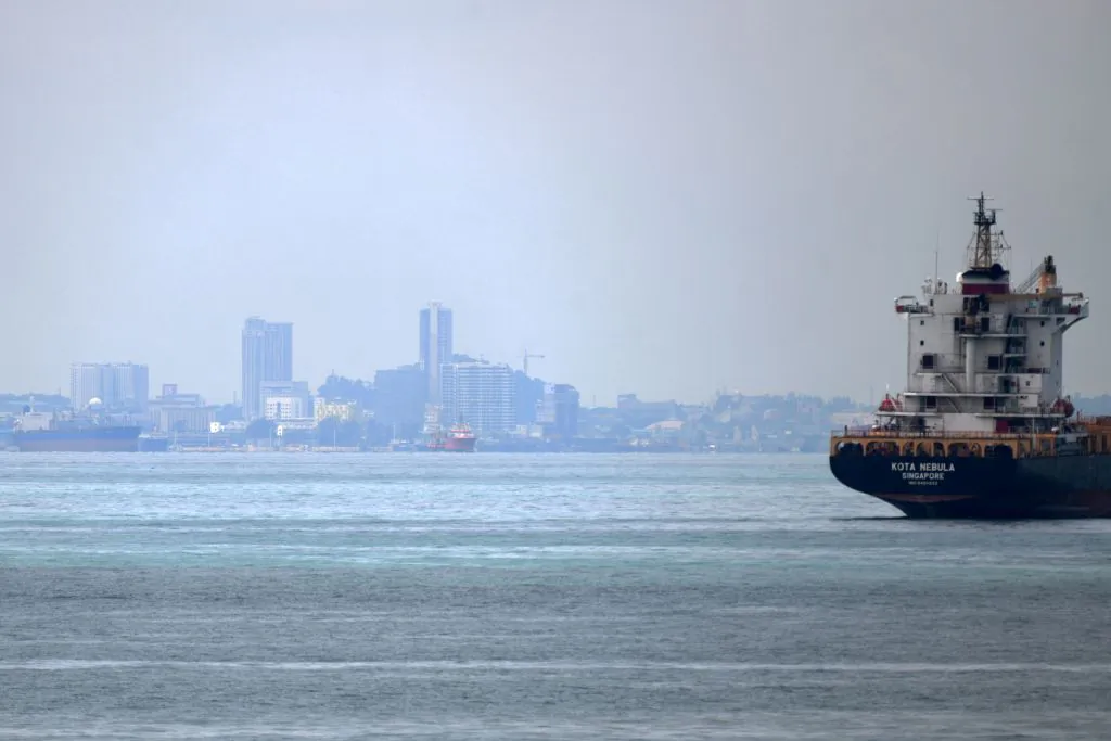 A vessel is seen opposite the Marina Pier in front of Indonesia's Batam island (background) in Singapore on May 2, 2020. (Roslan Rahman/AFP via Getty Images)