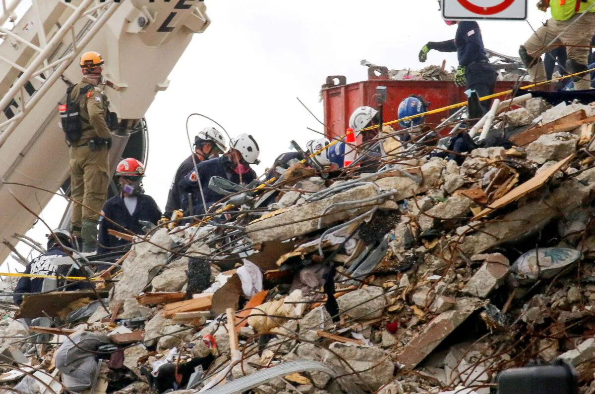Emergency workers conduct search and rescue efforts at the site of a partially collapsed residential building in Surfside, near Miami Beach, Fla., on June 29, 2021. (Joe Skipper/Reuters)