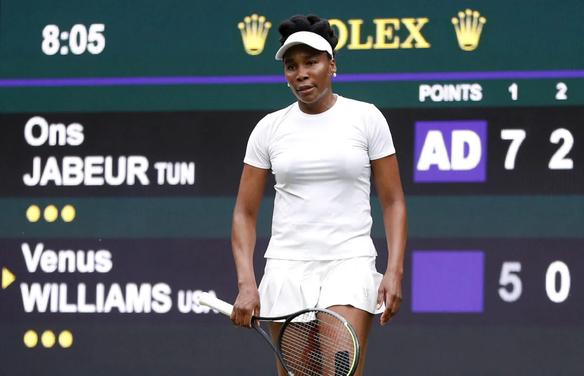 Venus Williams of the United States reacts during her second round match against Tunisia's Ons Jabeur during the Wimbledon Tennis Championships at the All England Lawn Tennis and Croquet Club in London, UK, on June 30, 2021. (Peter Nicholls/Reuters)