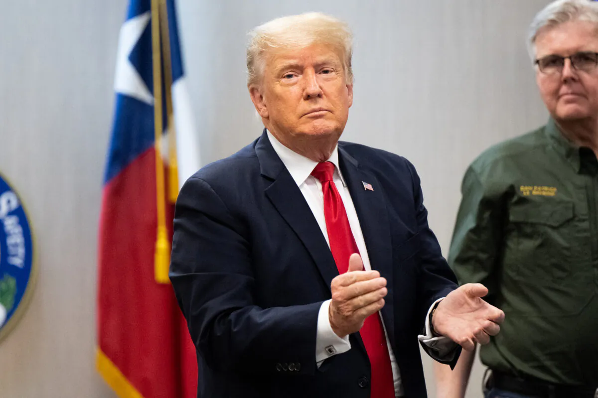 Former President Donald Trump applauds a member of the media after a border security briefing in Weslaco, Texas, on June 30, 2021. (Brandon Bell/Getty Images)