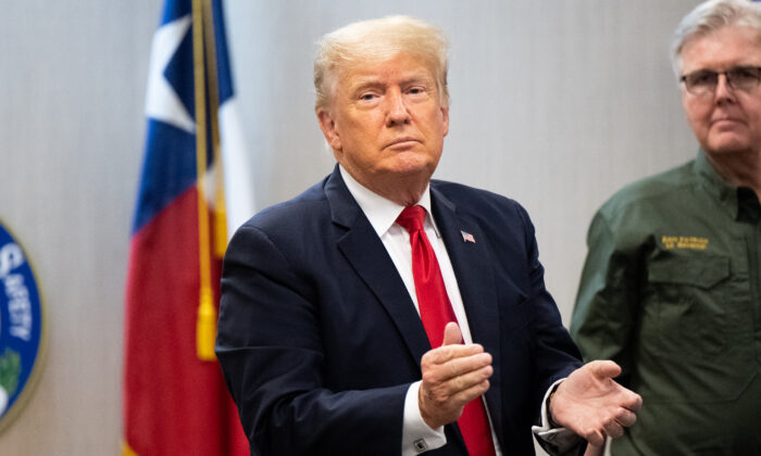 Former President Donald Trump applauds a member of the media after a border security briefing in Weslaco, Texas, on June 30, 2021. (Brandon Bell/Getty Images)