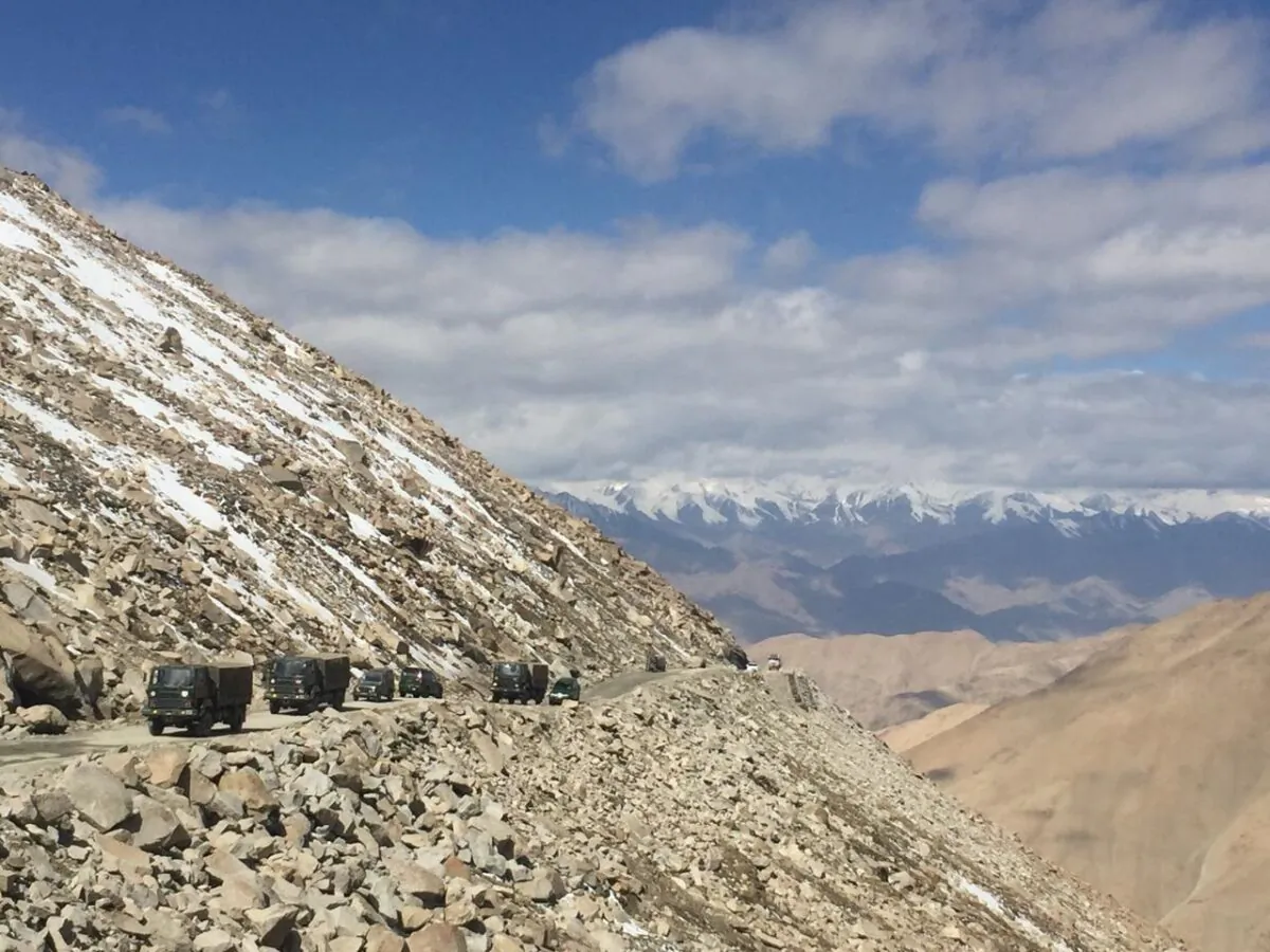 An Indian army convoy moves on the high mountain route from Leh city to Changla pass, the second-highest mountain pass in the world at over 16,800 feet above sea level, in Ladakh on June 22, 2021. (Venus Upadhayaya/The Epoch Times)