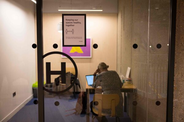 A woman works in a meeting room