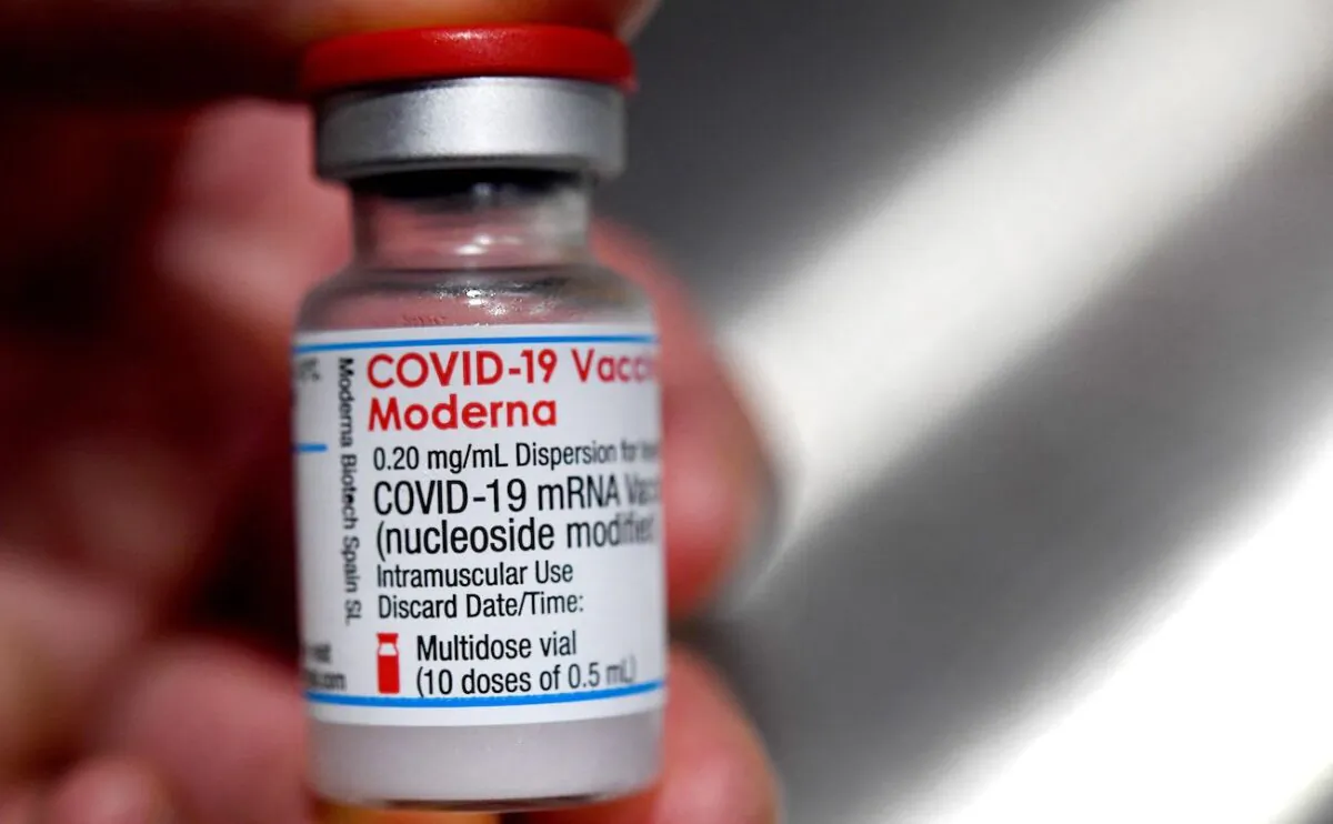 A person holds a vial of Moderna COVID-19 vaccine on June 29, 2021. (Fred Tanneau/AFP via Getty Images)