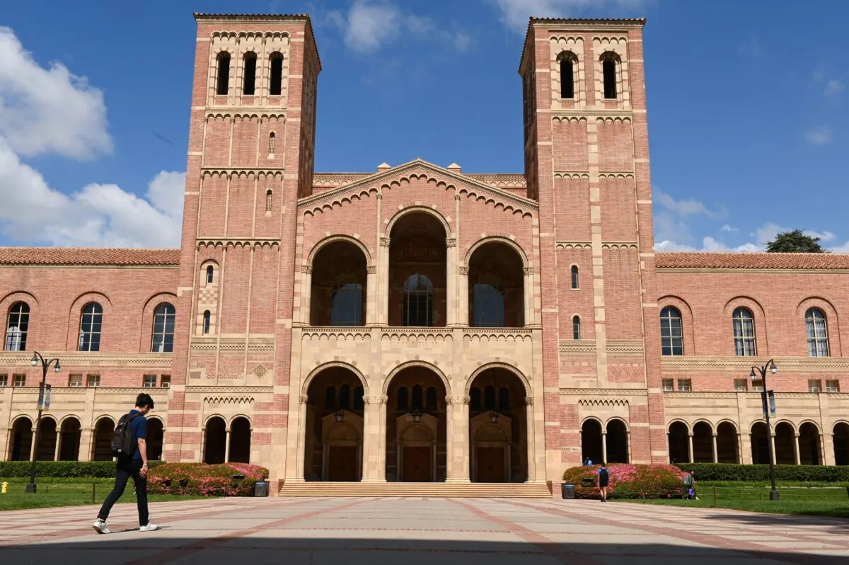 A student walks toward Royce Hall on the campus of University of California at Los Angeles (UCLA) in Los Angeles on March 11, 2020. (Robyn Beck/AFP via Getty Images)