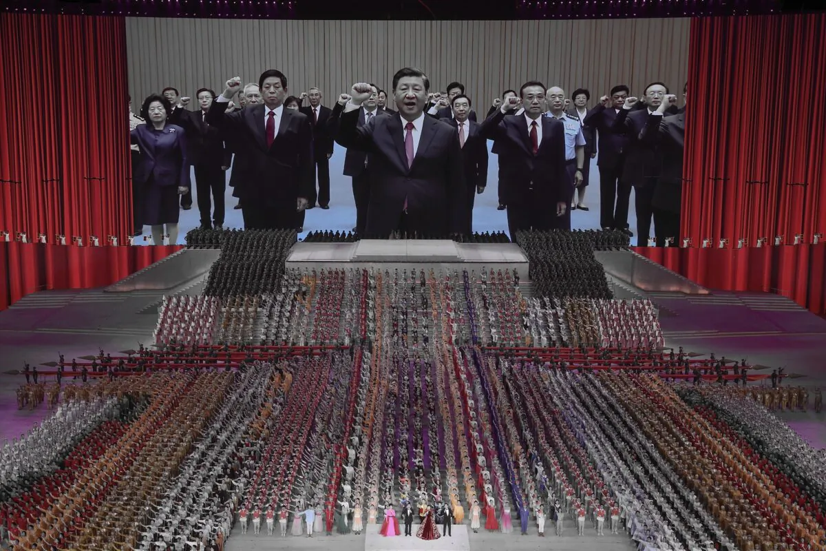 A large screen showing communist officials and Chinese leader Xi Jinping (center) during a mass gala marking the 100th anniversary of the Chinese Communist Party at the Olympic Bird's Nest stadium in Beijing, China on June 28, 2021. (Lintao Zhang/Getty Images)