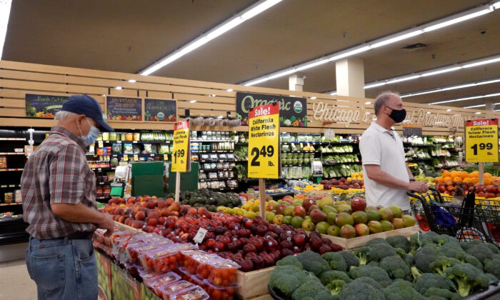 Customers shop for produce at a supermarket in Chicago, Illinois, on June 10, 2021. (Scott Olson/Getty Images)