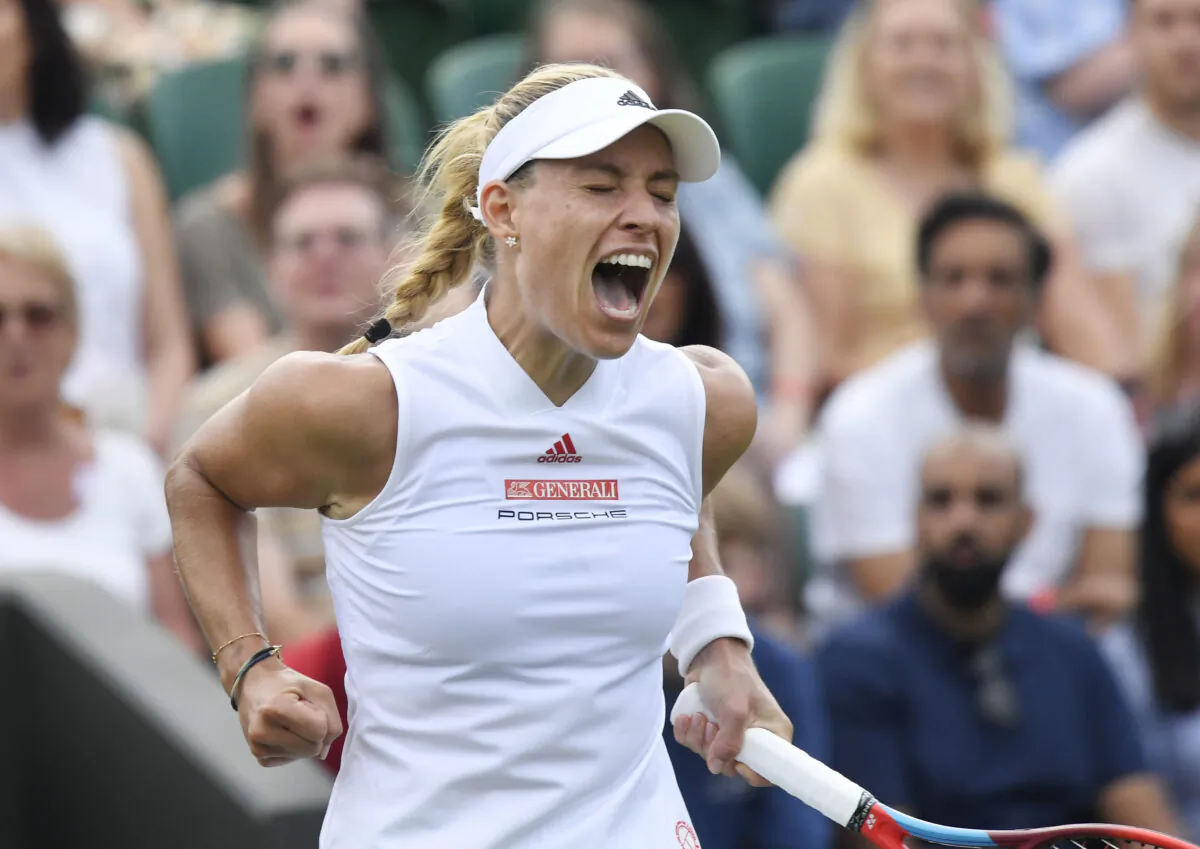 Germany's Angelique Kerber celebrates during her second round match against Spain's Sara Sorribes Tormo during The  Wimbledon Championships at the All England Lawn Tennis and Croquet Club, London, Britain, on July 1, 2021. (Toby Melville/Reuters)