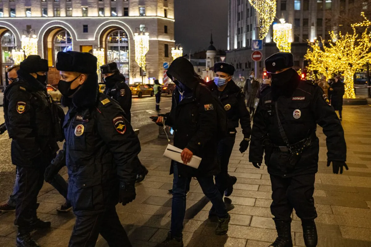 Police officers detain a supporter of opposition leader Alexei Navalny staging a picket in front of the Federal Security Service (FSB) headquarters in downtown Moscow on Dec. 21, 2020. (Dimitar Dilkoff/AFP via Getty Images)