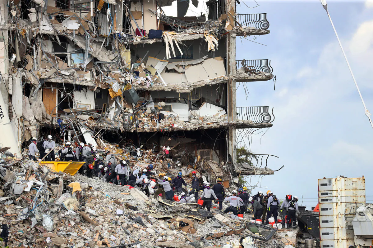 Search and rescue teams look for possible survivors and to recover remains at the site of the 12-story oceanfront Champlain Towers South Condo, at 8777 Collins Ave., that partially collapsed in Surfside, Fla, on June 29, 2021. (Mike Stocker/Sun Sentinel/TNS)