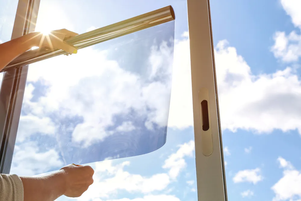 Window film is the perfect solution to reduce the amount of visible, infrared, and ultraviolet radiation while creating privacy. (Petr Smagin/Shutterstock)