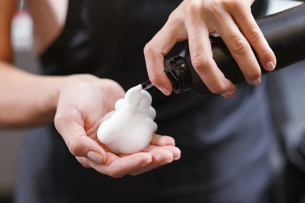 "Conditioner" is a vague term that refers to a wide range of hair products designed to make hair more manageable and also treat common hair problems. (Dmytro Zinkevych/Shutterstock)