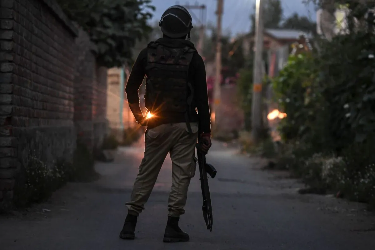 A soldier from the Indian government forces stands guard during a gun-battle started between suspected militants and Indian government forces at Malhoora on the outskirts of Srinagar on June 28, 2021. (Tauseef Mustafa/AFP via Getty Images)