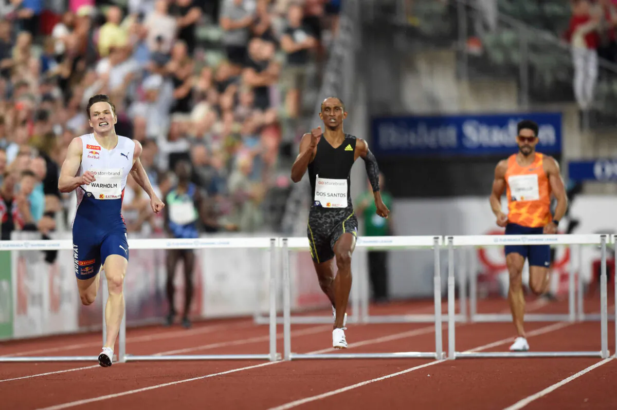 Norway's Karsten Warholm (L) and Brazil's Alison Dos Santos compete in the 400m hurdles men final at the Diamond League track and field meeting in Oslo, Norway, on July 1, 2021. (Annika Byrde/NTB/AFP via Getty Images)