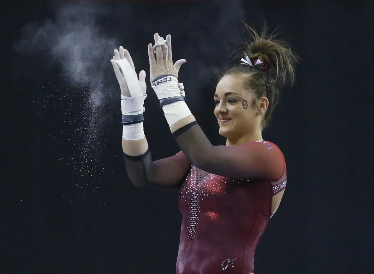 Oklahoma gymnast Maggie Nichols reacts after her routine on the uneven bars in the Perfect 10 Challenge at the Bart and Nadia Sports Experience in Oklahoma City on Feb. 16, 2019. (AP Photo/Sue Ogrocki, File)