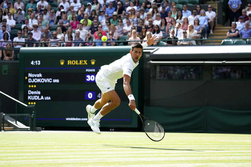 Serbia's Novak Djokovic plays a return to Denis Kudla of the United States during the men's singles third round match on day five of the Wimbledon Tennis Championships in London, on July 2, 2021. (Alberto Pezzali/AP Photo)