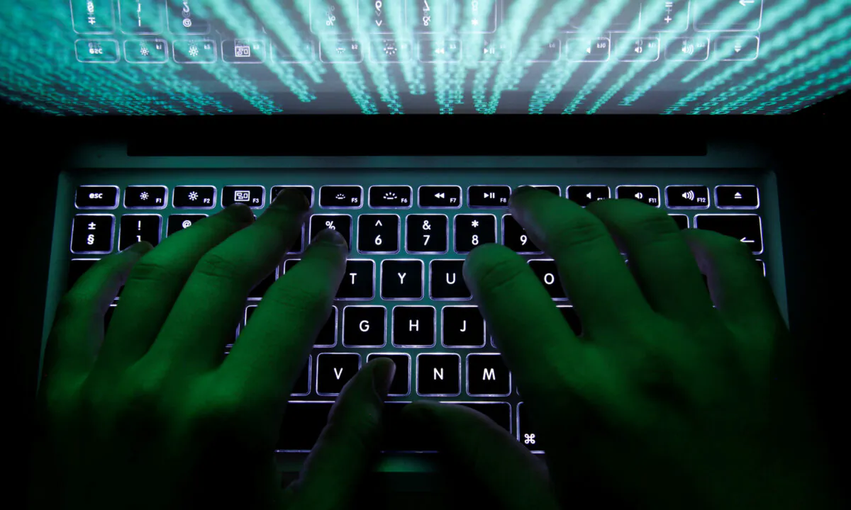 A man types on a computer keyboard in Warsaw on Feb. 28, 2013. (Kacper Pempel/Reuters)