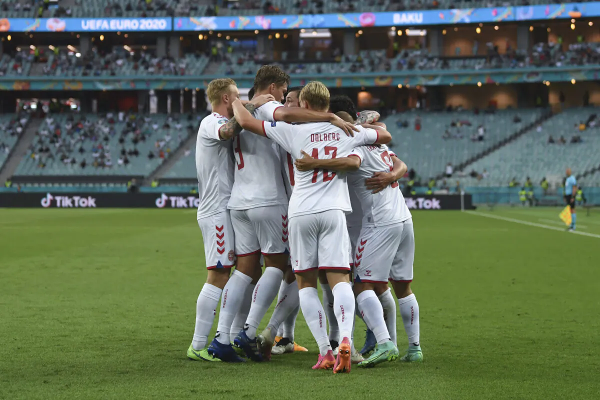 Denmark's Thomas Delaney celebrates with teammates after scoring his side's opening goal during the Euro 2020 soccer championship quarterfinal match between Czech Republic and Denmark, at the Olympic stadium in Baku, July 3, 2021. (Ozan Kose, Pool via AP)