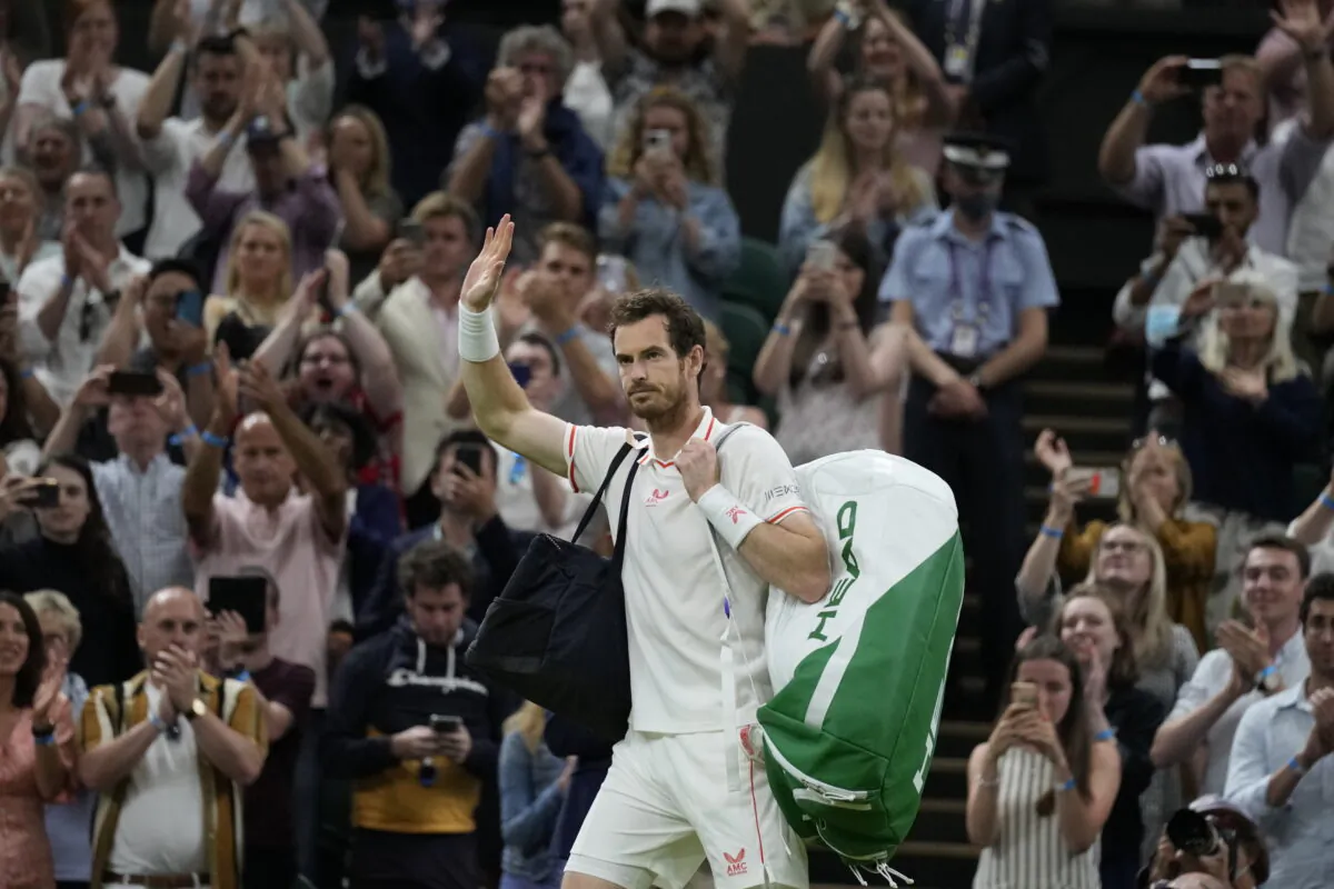Britain's Andy Murray leaves Centre Court after being defeated by Canada's Denis Shapovalov in the men's singles third round match on day five of the Wimbledon Tennis Championships in London, on July 2, 2021. (Kirsty Wigglesworth/AP Photo)