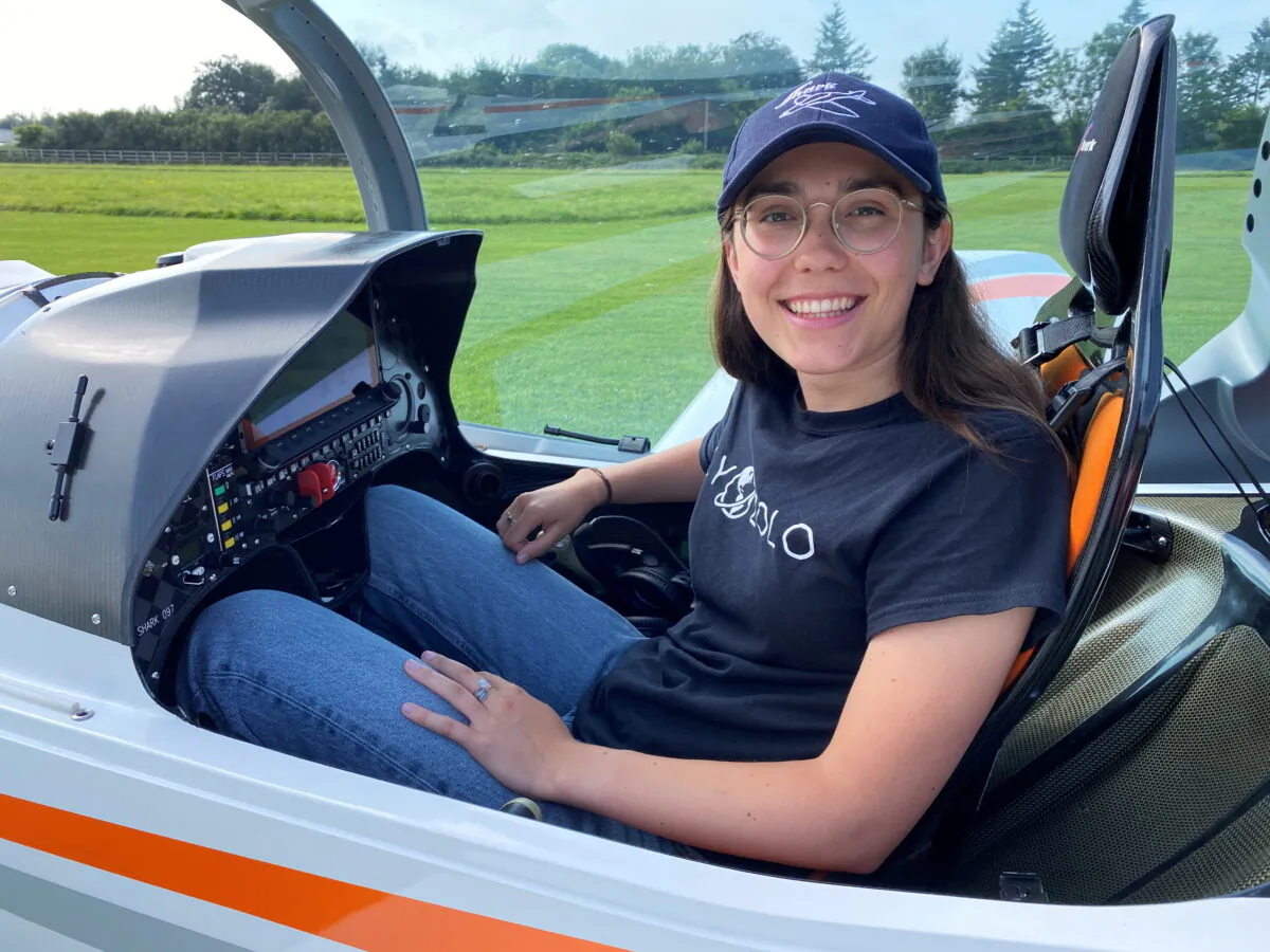 Zara Rutherford, 19, poses in a Shark ultralight aircraft at Popham Airfield near Winchester, Britain, on July 26, 2021. (Gerhard Mey/Reuters)
