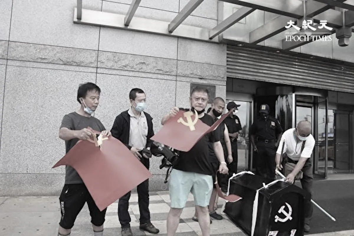 Scores of exiled Tibetans, Hongkongers, Chinese dissidents, and others burn down the flags of the Chinese Communist Party (CCP) and present a black coffin for the CCP in protest of its brutal rule in China in front of China's consulate general in New York City, on July 1, 2021, its 100th anniversary. (Huang Xiaotang/The Epoch Times)