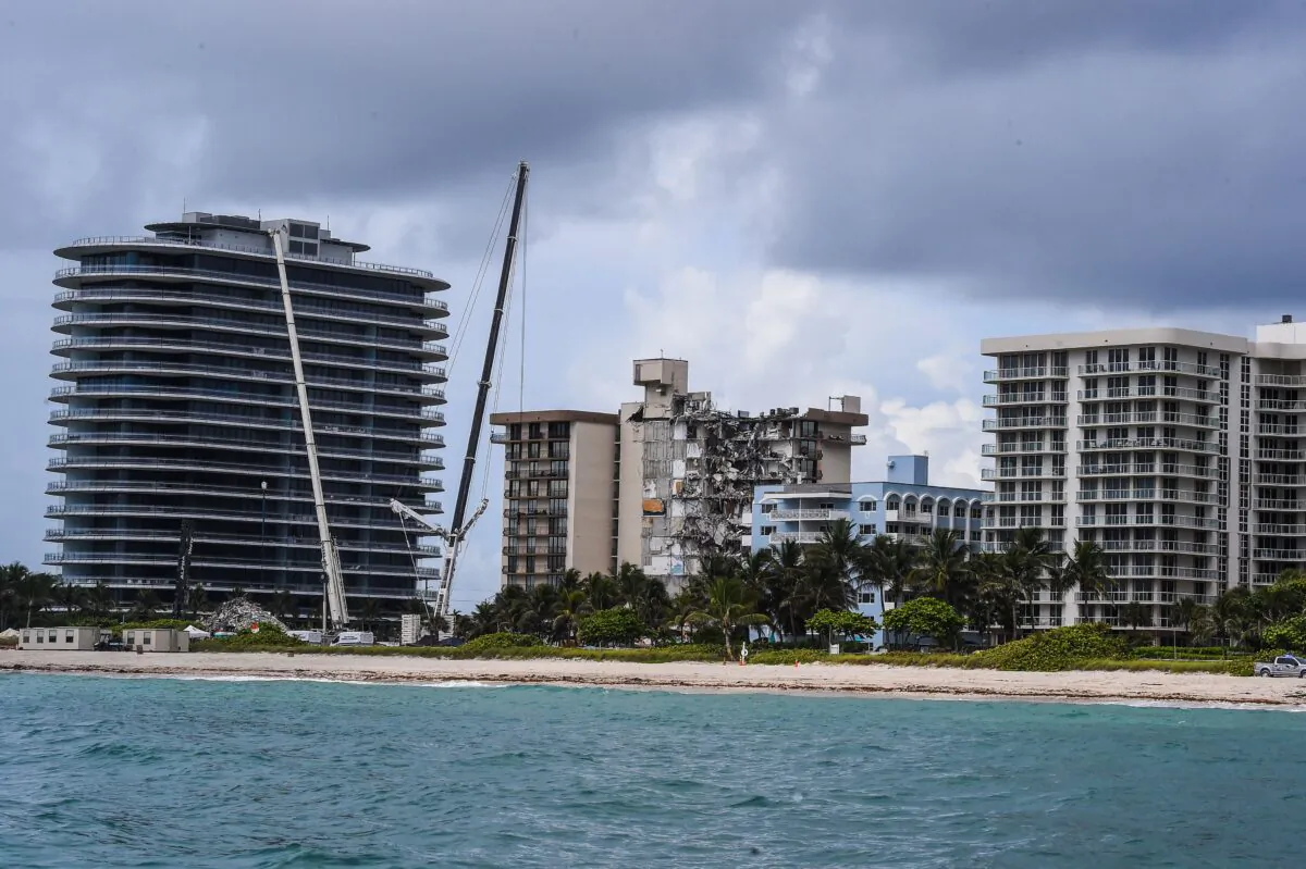 Search and Rescue teams look for possible survivors in the partially collapsed 12-story Champlain Towers South condo building in Surfside, Fla., on June 29, 2021. (Chandan Khanna/AFP via Getty Images)