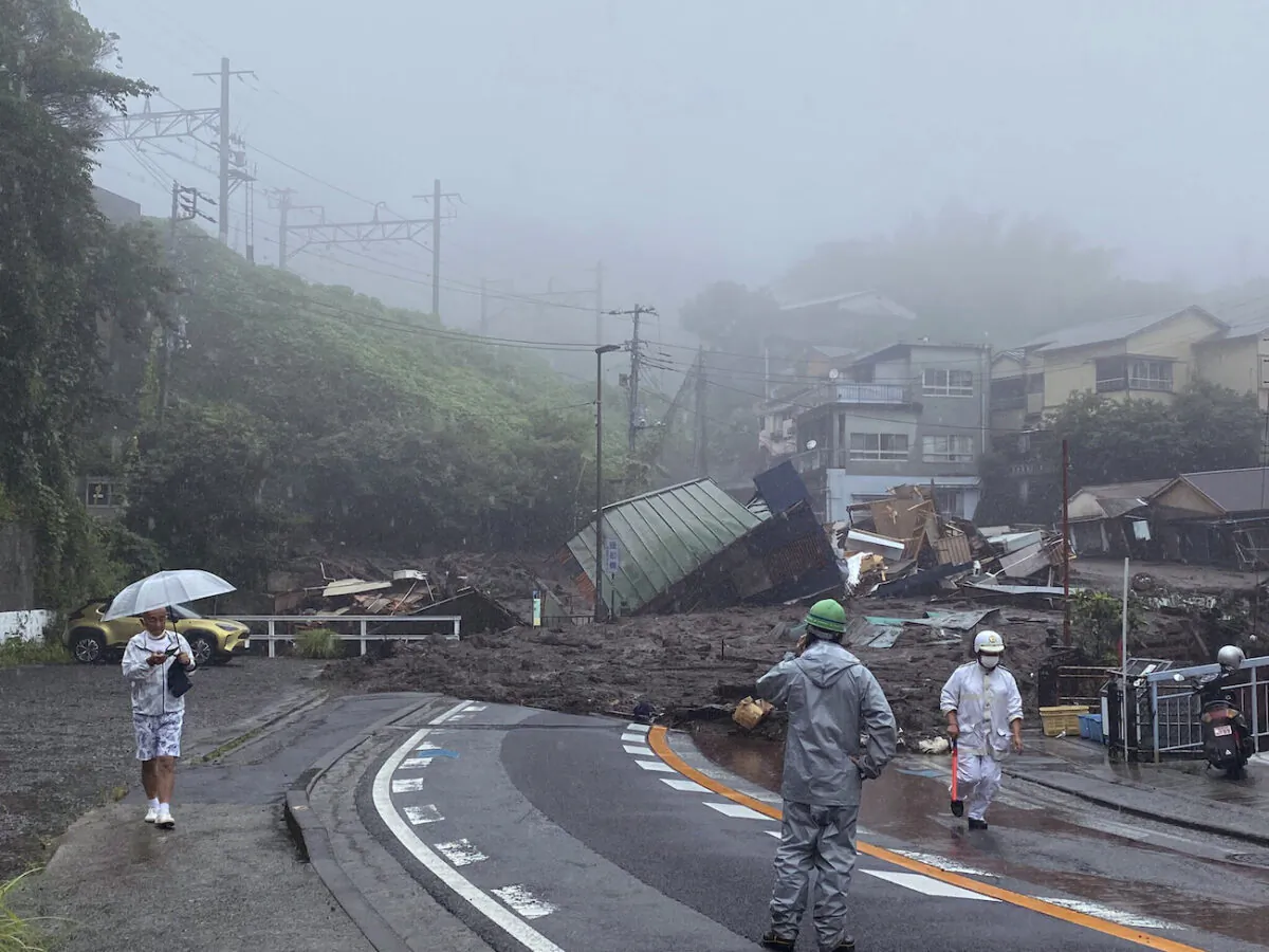 A road is covered by mud and debris following heavy rain in Atami city, Shizuoka prefecture, on July 3, 2021. (Satoru Watanabe via AP)