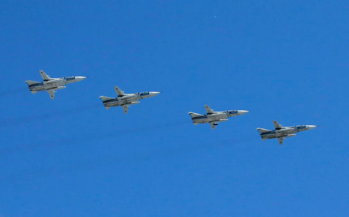 Russian Sukhoi planes are seen flying in a formation. (Maxim Shemetov/File/Reuters)