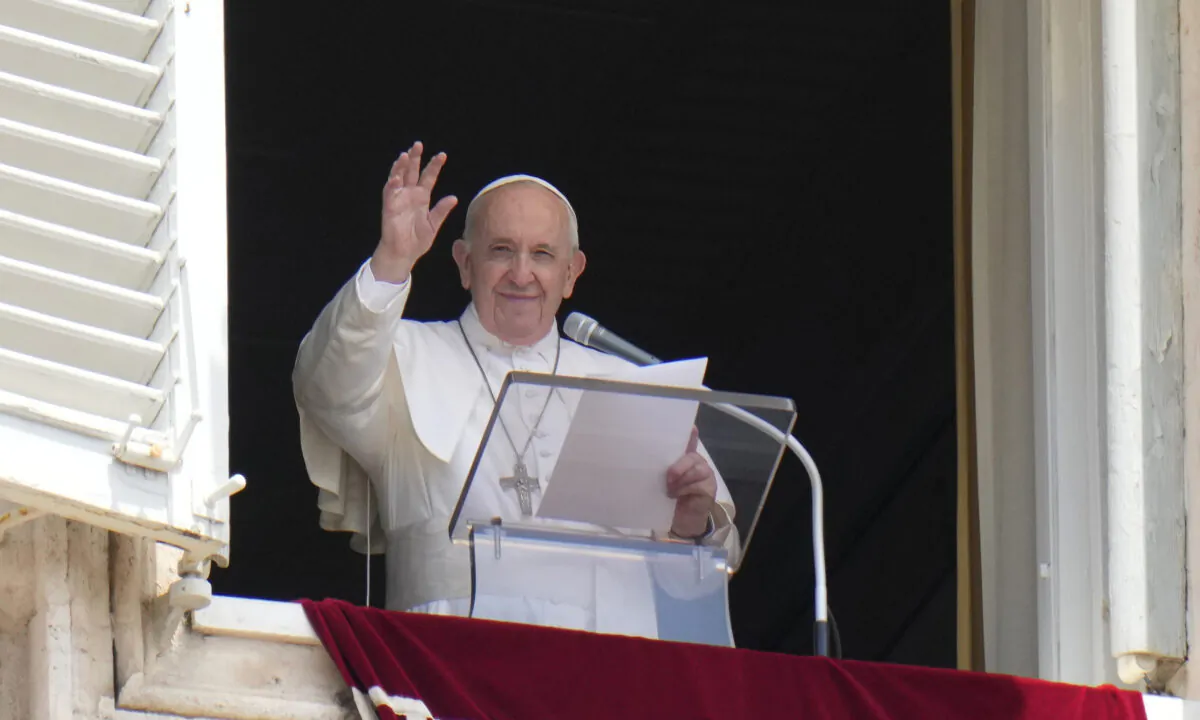 Pope Francis waves to the crowd from the window of his studio overlooking St.Peter's Square at the Vatican on July 4, 2021.  (Alessandra Tarantino/AP Photo)