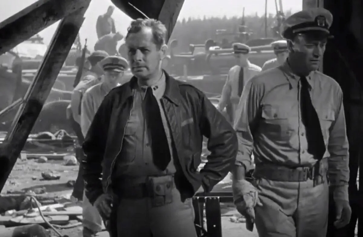 The two main actors in the movie are Robert Montgomery (L) and John Wayne in “They Were Expendable.” (Metro-Goldwyn-Mayer)