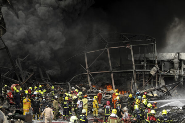 Firefighters are working at the scene of a big explosion