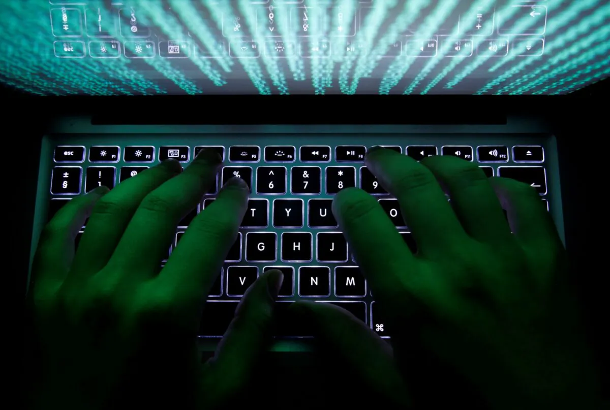 A man types on a computer keyboard in this Feb. 28, 2013 illustration file picture. (Kacper Pempel/Reuters)