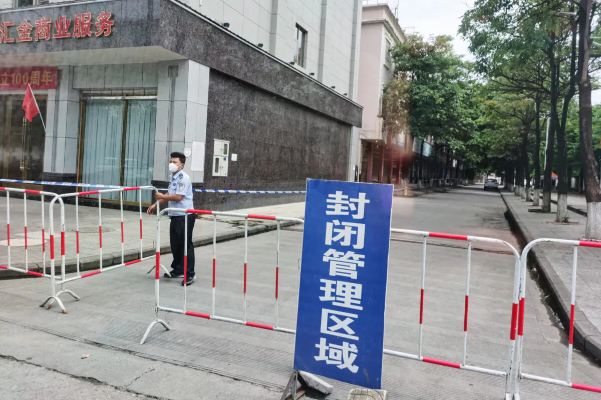 A street is blocked off as part of COVID-19 coronavirus measures in the city of Ruili which borders Myanmar, in China's southwestern Yunnan province on July 5, 2021. (STR/AFP via Getty Images)