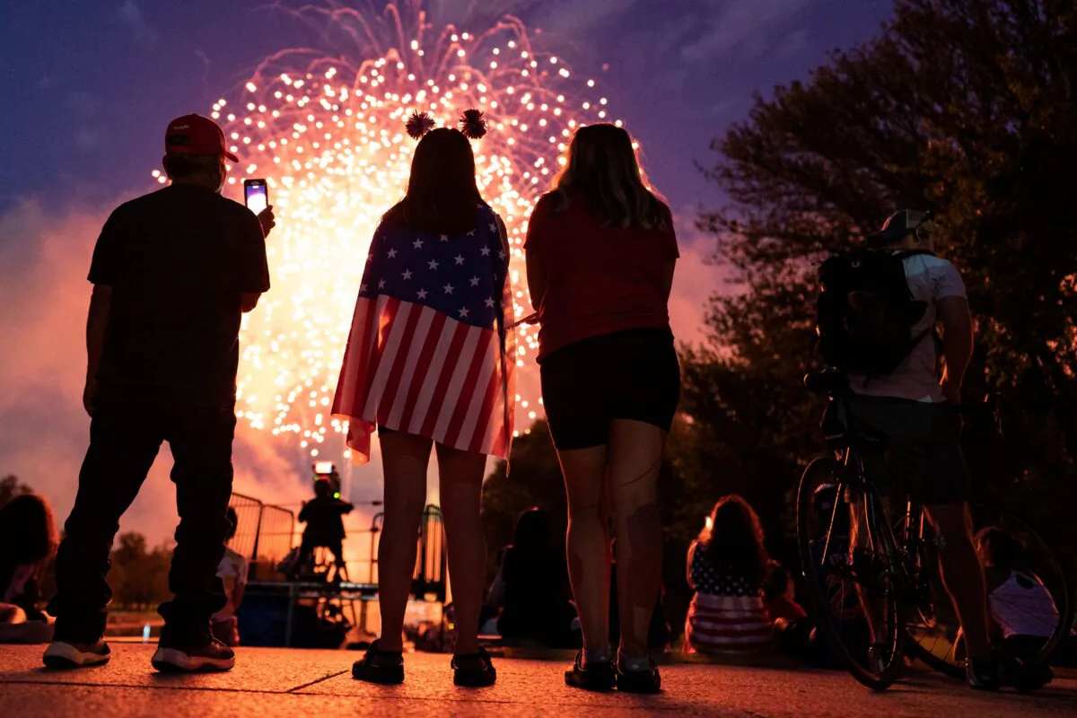 Visitors watch the Independence Day fireworks display near the Lincoln Memorial on the National Mall in Washington, on July 4, 2021. (Alex Edelman/AFP via Getty Images)