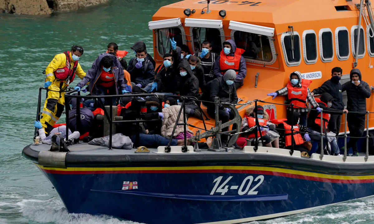 Following a small boat incident, a group of illegal immigrants are onboard a lifeboat in Dover, Kent, on July 4, 2021. (Gareth Fuller/PA)
