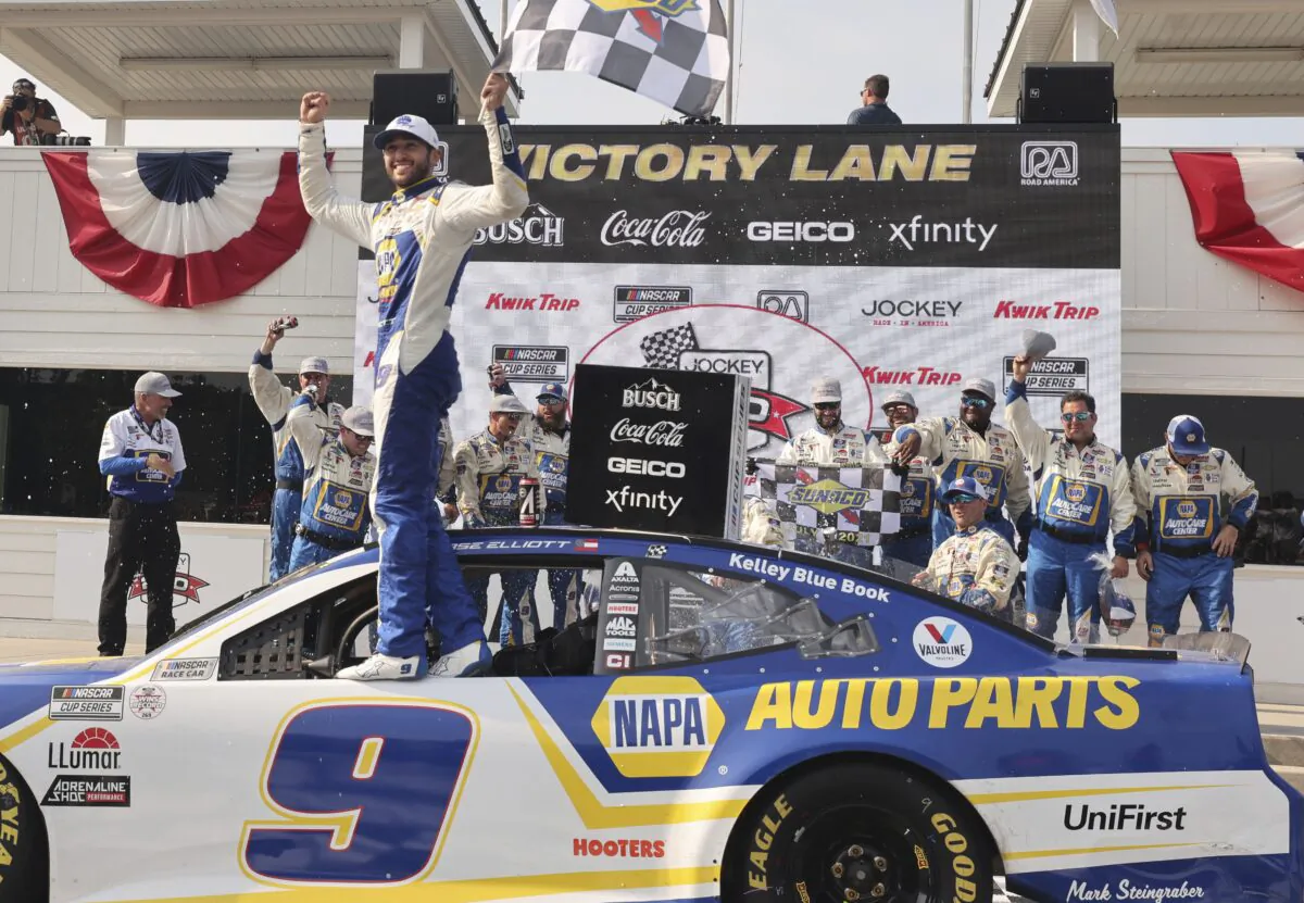 Chase Elliott celebrates his victory in a NASCAR Cup Series auto race Sunday, July 4, 2021, at Road America in Elkhart Lake, Wis. (AP Photo/Jeffrey Phelps)