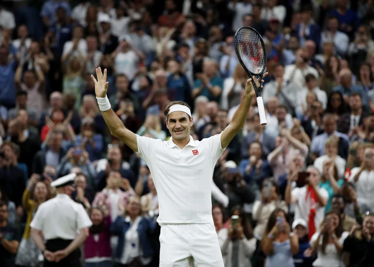 Switzerland's Roger Federer celebrates winning his fourth round match against Italy's Lorenzo Sonego at the Wimbledon Championships in London on July 5, 2021. (Paul Childs/Reuters)