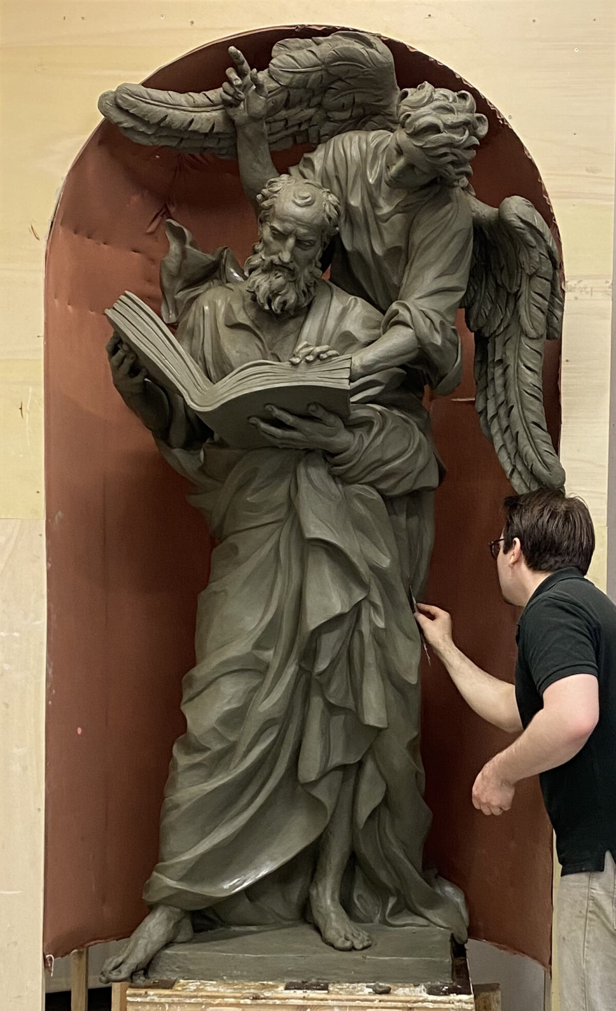 A detail of "Saint Matthew," one of the Four Evangelists, 2021, by Cody Swanson. Clay in progress. Chapel of the Holy Cross, Jesuit High School, Tampa, Fla. (Courtesy of Cody Swanson)
