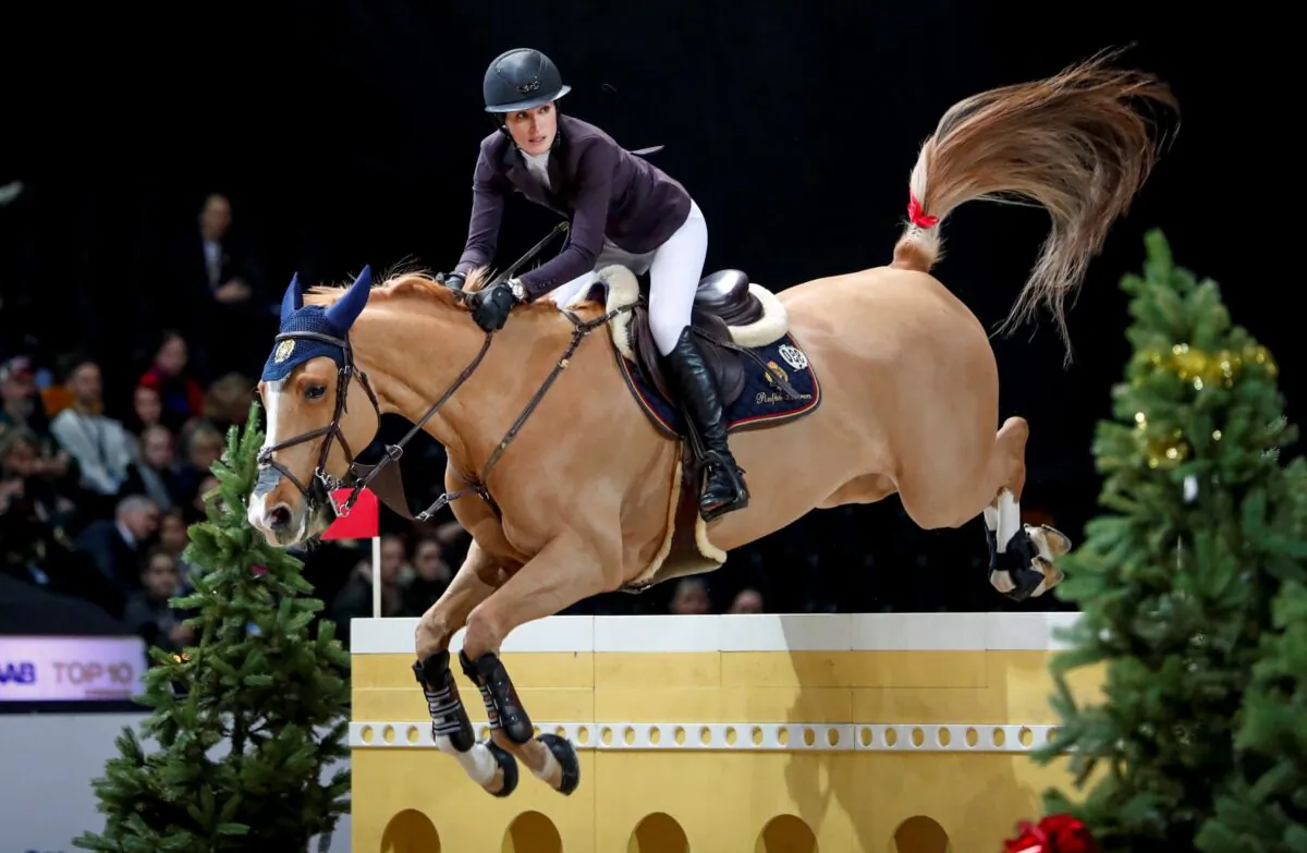 Jessica Springsteen rides Volage du Val Henry at the Sweden International Horse Show at the Friends Arena in Solna, Sweden, on Dec. 1, 2019. (Christine Olsson/TT via AP)