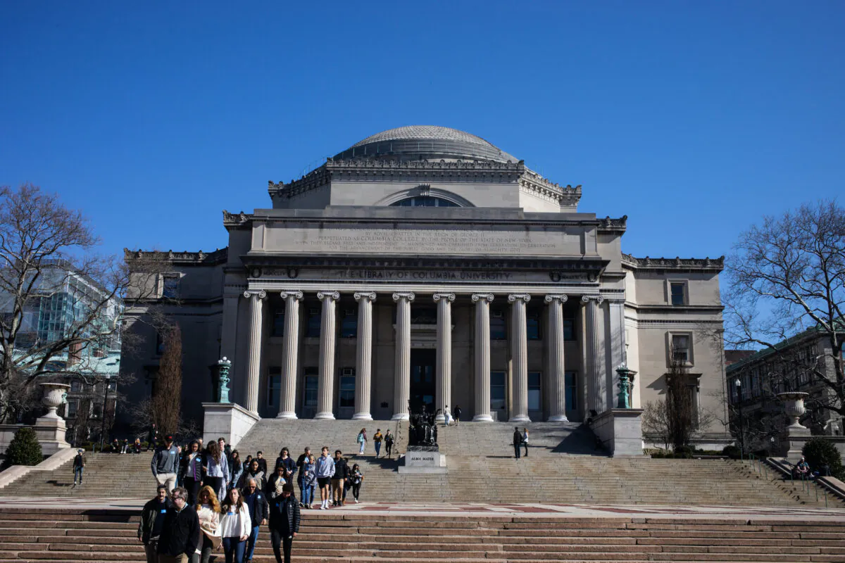 People walk on the Columbia University campus in New York City, on March 9, 2020. (Jeenah Moon/Getty Images)