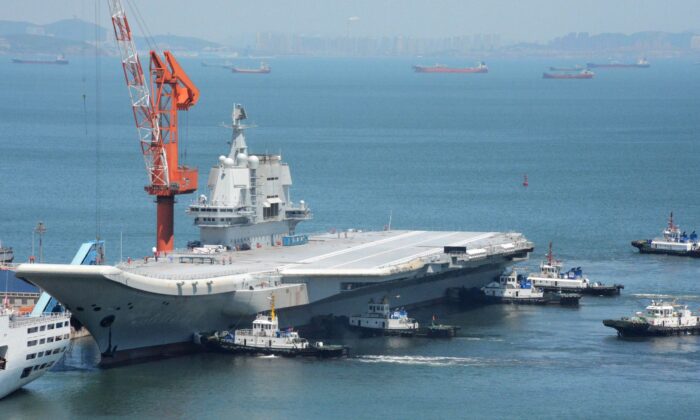 China's first domestically manufactured aircraft carrier, known as "Type 001A"or “Shandong,” returns to port in Dalian, in China's northeastern Liaoning Province, after its first sea trial, on May 18, 2018. (AFP via Getty Images)