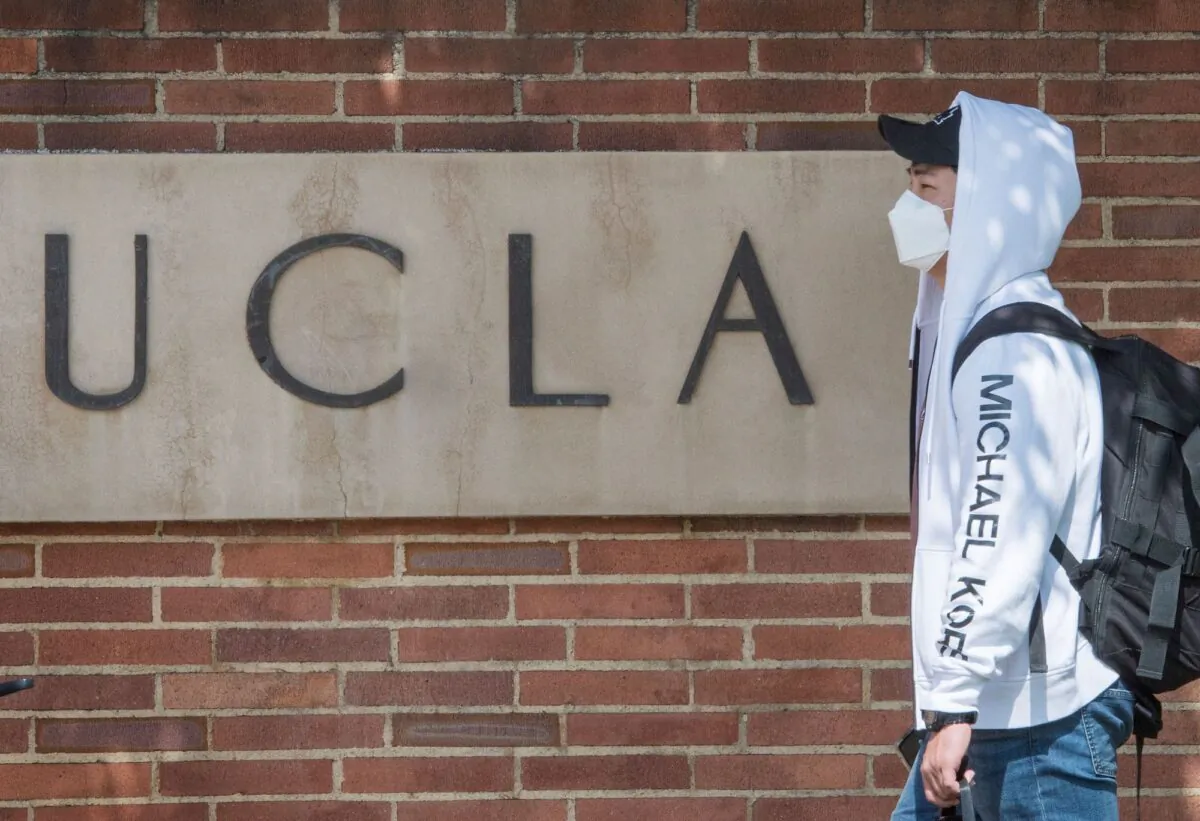 A student wears a face mask on the campus of the UCLA college in Westwood, Calif. on March 6, 2020. (Mark Ralston/AFP via Getty Images)