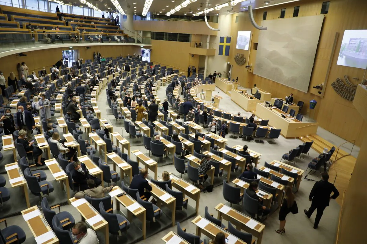 Members of Parliament arrive at Parliament in Stockholm on July 7, 2021. (Christine Olsson/TT via AP)