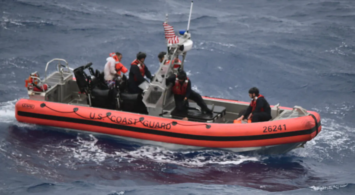 The Coast Guard Cutter Thetis’ crewmembers deploy the cutter’s small boat to rescue people in the water approximately 32 miles southeast of Key West, Fla., on Tuesday, July 6, 2021. (U.S. Coast Guard via AP)
