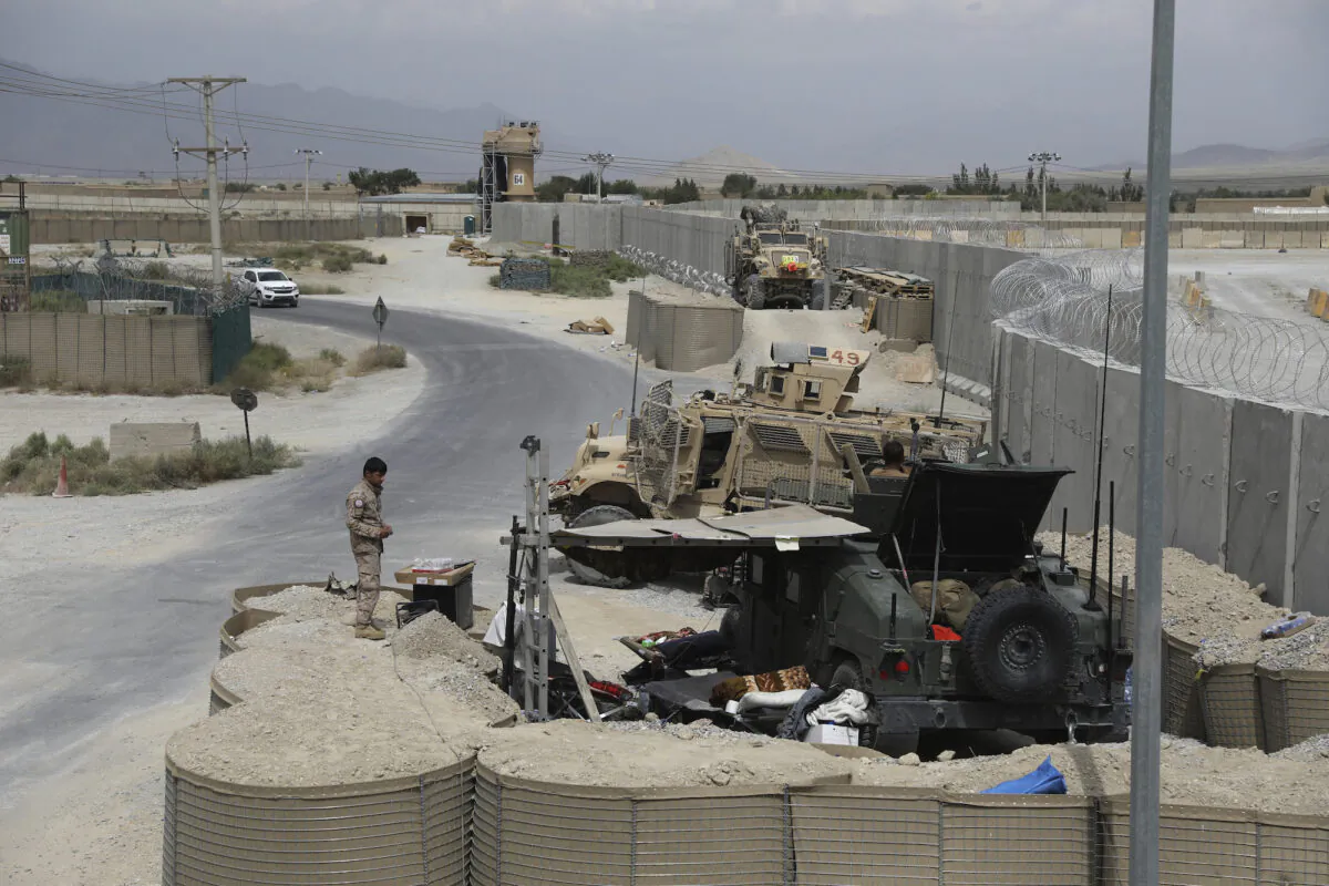 A member of the Afghan security forces stands guard following the U.S. military's departure from Bagram Air Base in Afghanistan on July 5, 2021. (Rahmat Gul/AP Photo)