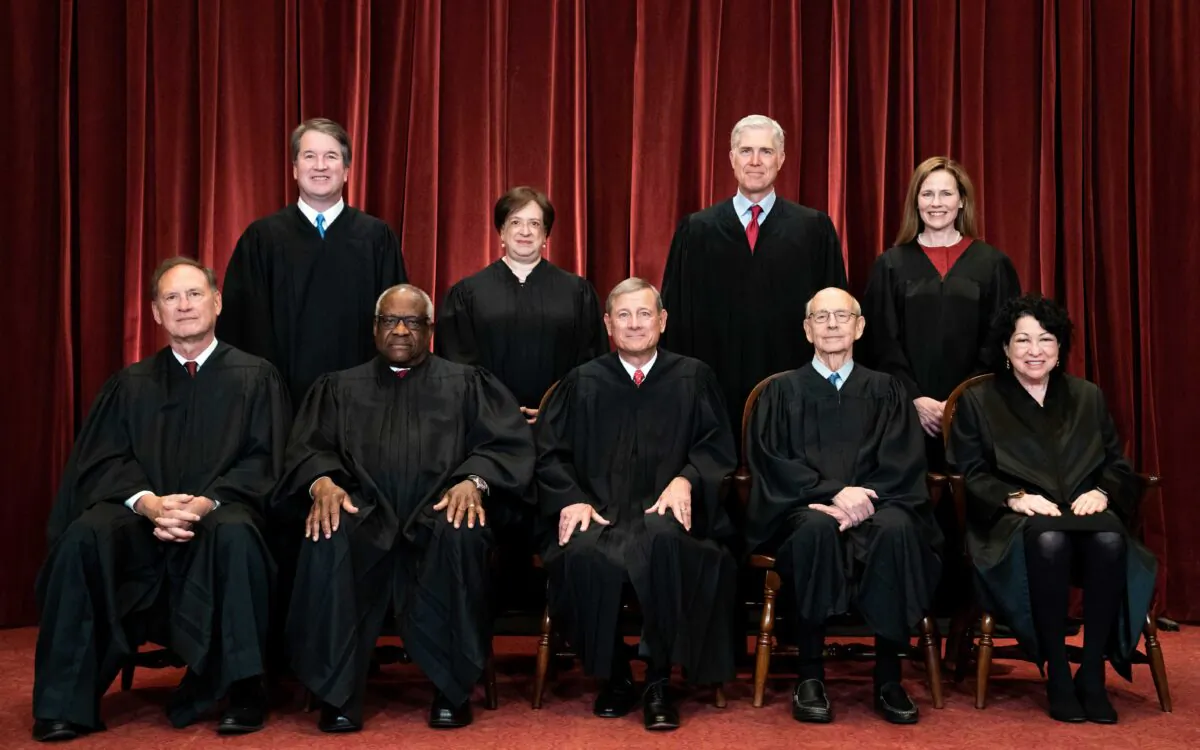 Members of the Supreme Court pose for a group photograph at the Supreme Court in Washington on April 23, 2021. Seated from left: Associate Justice Samuel Alito, Associate Justice Clarence Thomas, Chief Justice John Roberts, Associate Justice Stephen Breyer, and Associate Justice Sonia Sotomayor. Standing from left: Associate Justice Brett Kavanaugh, Associate Justice Elena Kagan, Associate Justice Neil Gorsuch, and Associate Justice Amy Coney Barrett. (Erin Schaff/Pool/Getty Images)